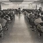 1960's people listening to speaker